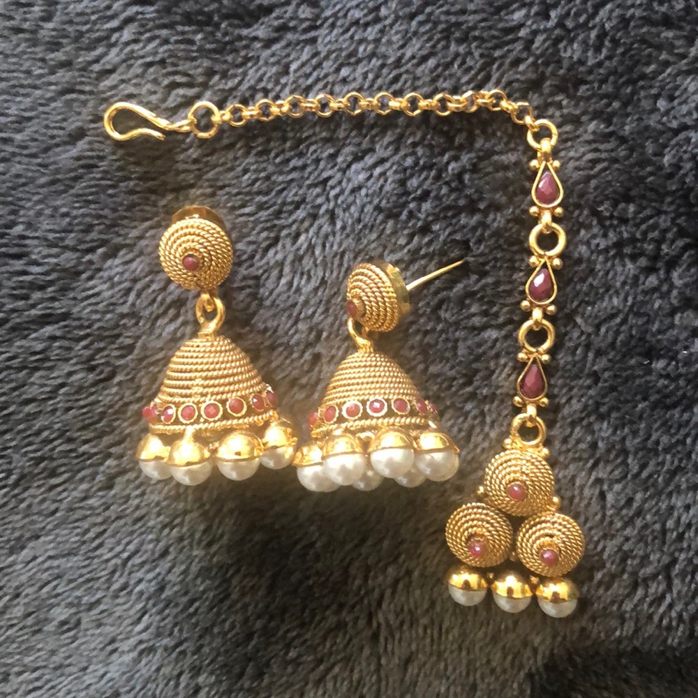 Gold earrings with matching bindi